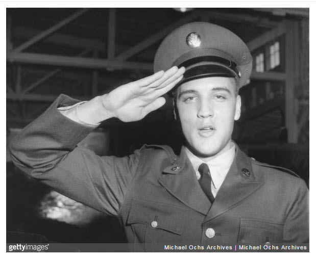 Dee's uncle served with Elvis in Germany, and he has a similar photo of Elvis, only Elvis is posing near his Army jeep.  c. GETTY IMAGES