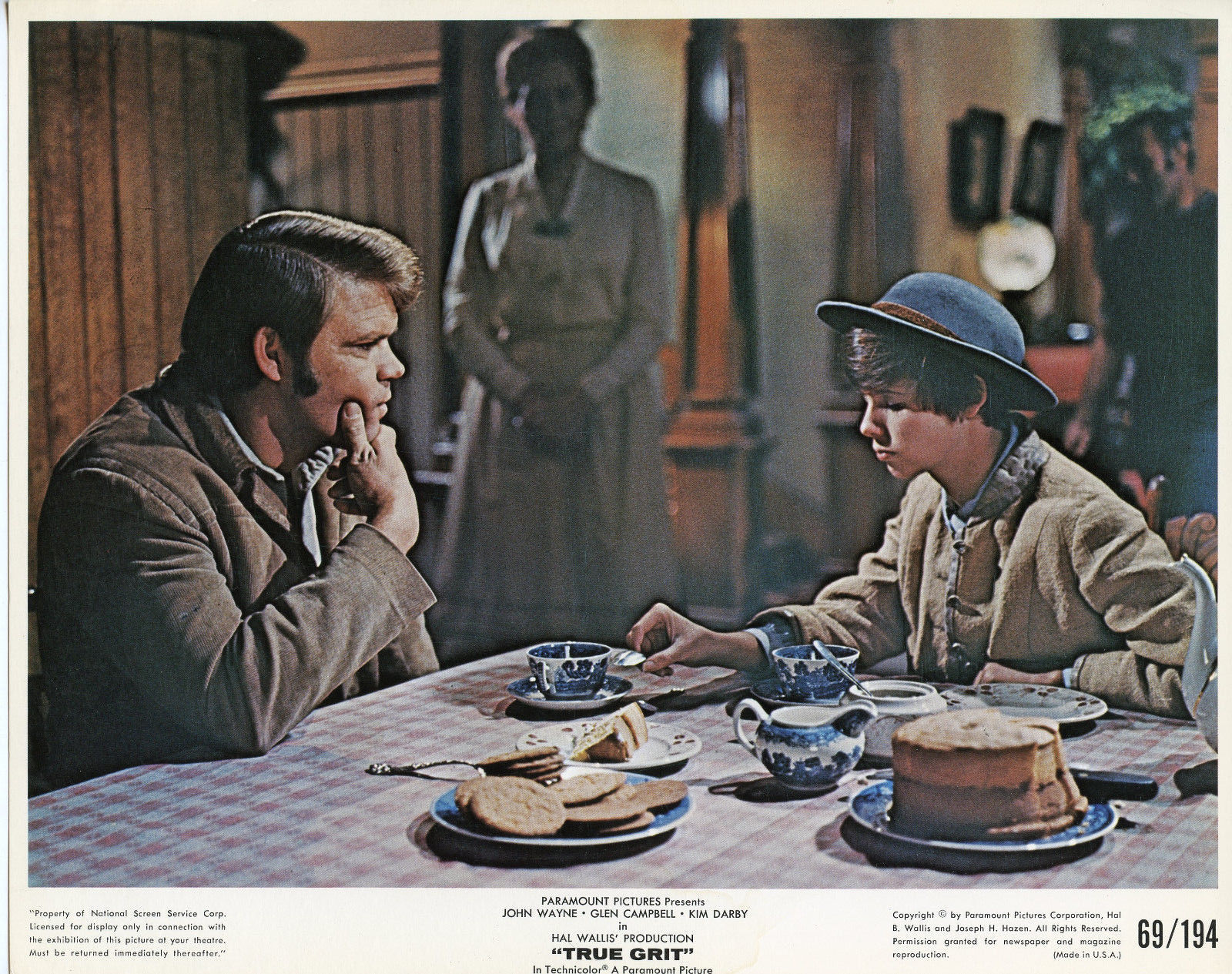 TRUE GRIT LOBBY CARD_MATTIE AND GLEN AT TABLE.jpg