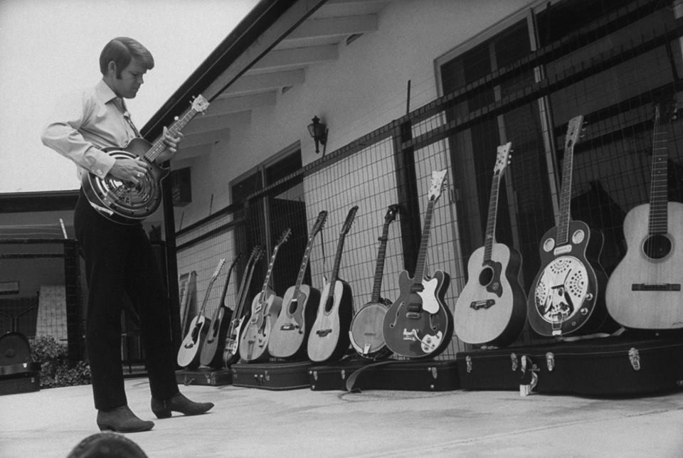 Glen Campbell Showcasing Guitars.jpg