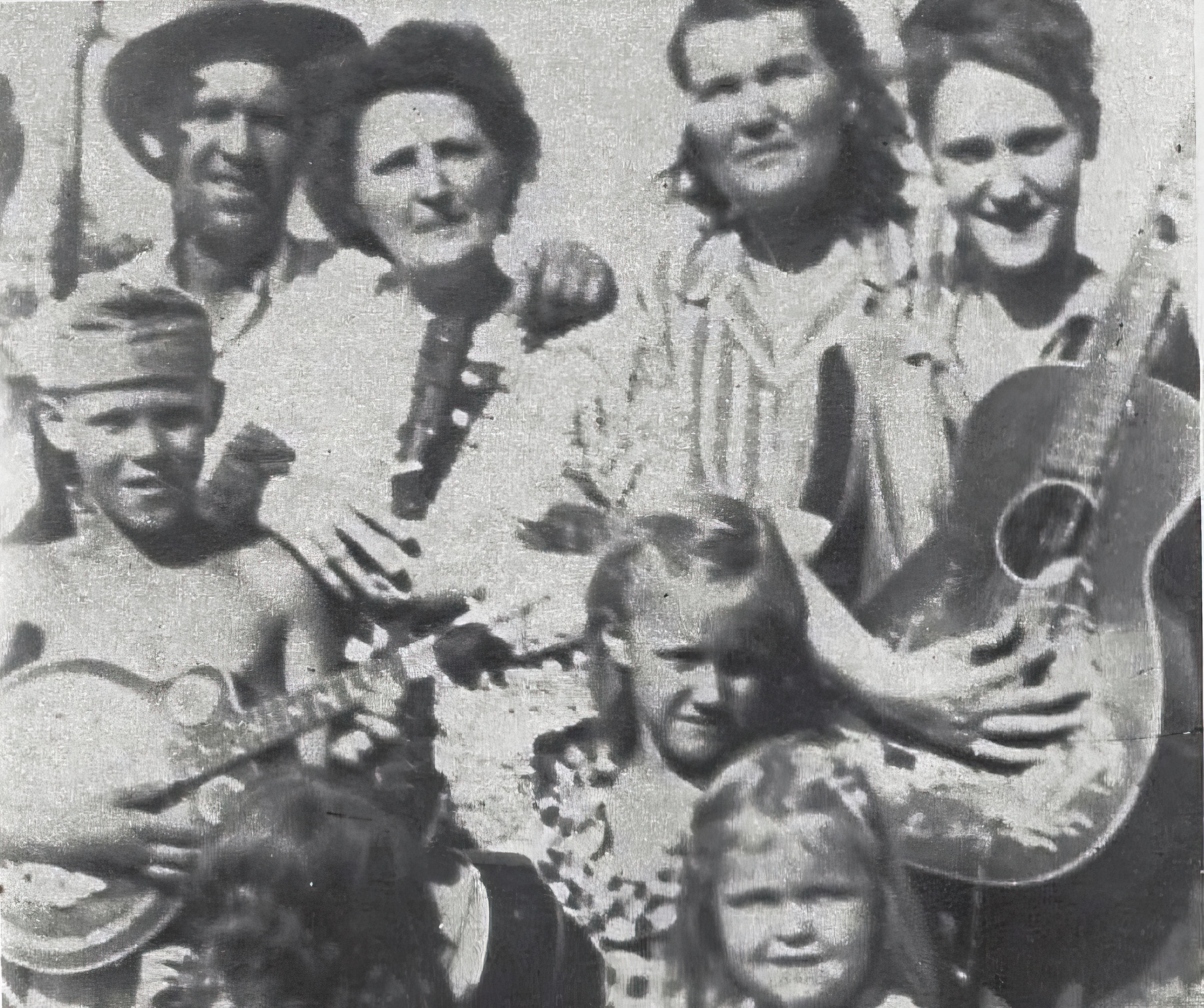 Glen Campbell with a Regal Resonator Mandolin.jpg