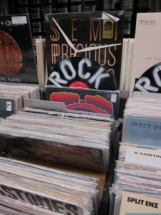 Records were spray painted with the names of music categories.