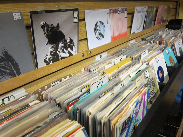 Nice! 45s with picture sleeves, some records in plastic sleeves.